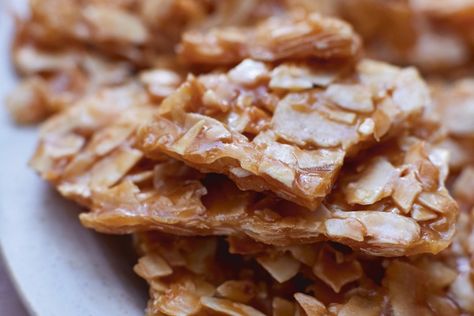 Toasted coconut brittle Coconut Brittle Recipe Easy, Toasted Coconut Brittle, Brittle Candy Recipes, Brittle Recipes Easy, Homemade Brittle Recipes, Coconut Brittle Recipes, Coconut Peanut Brittle Recipe, Cornflake Brittle, Dessert Snap