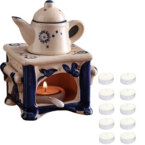 PRICES MAY VARY. HIGH-QUALITY MATERIAL - Our aromatherapy stove is made of high-quality ceramic material, high-temperature firing, hand-painted, exquisite workmanship, delicate texture, and durability EXQUISITE SHAPE - This lovely essential oil stove features a small teapot and stove shape with delicate patterns and beautiful details. Hollow-out design, candle light penetrates the furnace body, which is both ventilated and beautiful. Four-legged base design, more stable placement EASY TO USE - Y Tea Light Holder Ideas, Hollow Form Ceramics, Clay Oil Burner, Ceramic Wax Melter, Wax Melt Burner, Ceramic Lantern Ideas, Ceramic Glaze, Oil Stove, Valentines Bedroom