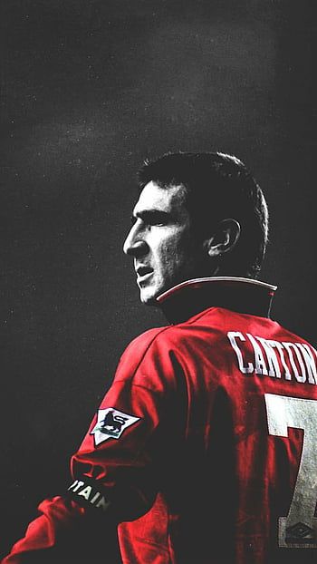 Eric Cantona played for a number of clubs including Leeds United, Manchester United, and the French national team. He was known for his exceptional technical ability, vision, and creativity on the field, and won numerous accolades throughout his career. Cantona's legacy as one of the greatest footballers of all time has endured, and he is also remembered for controversial incidents, including the "kung-fu kick" and his unexpected retirement at the age of 31. David Beckham Manchester United, French National Team, Manchester United Art, Manchester United Old Trafford, Manchester United Images, Football Artwork, Manchester United Team, Eric Cantona, Manchester United Wallpaper