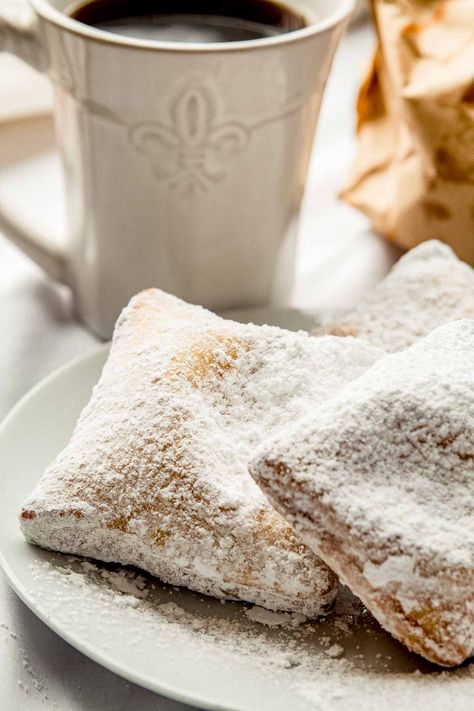 The best beignets recipe tastes just like the ones from Cafe du Monde in New Orleans. Warm and fluffy donuts are covered with powdered sugar and served with coffee for a delicious treat. French Beignets, Wedding Snack, Beignet Recipe, French Cooking, Night Wedding, Southern Cooking, Evaporated Milk, French Food, French Quarter