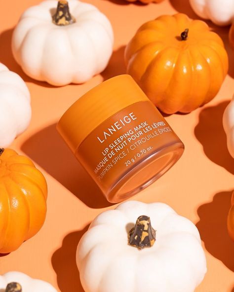 Glitter Magazine | Laneige New Seasonal Lip Sleeping Masks Will Spice up Your Holiday Season Laneige Lip Sleeping Mask Pumpkin, Pumpkin Spice Laneige, Pumpkin Beauty Products, Pumpkin Product Photography, Fall Skincare Photography, Fall Skincare Aesthetic, Fall Product Photoshoot, Autumn Product Photography, Soaps Photography