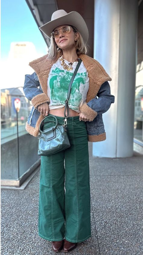 Upgrade your fashion game with a cowboy winter outfit! Create this look by pairing fun green wide-leg jeans with a casual graphic tee, a cozy denim jacket, and of course, matching Western boots and a modern cowboy hat. Don’t forget to add some extra accessories to complete the ensemble. Rock this cool look at a country concert, music festival, or any other event to totally stand out! Hunter Premo. Cowboy Winter Outfits for Women Teal Cowgirl Boots Outfit, Cowboy Winter Outfits, Jean Concert Outfit, Cowboy Boots Winter Outfit, Country Concert Outfit Jeans, Fall Country Outfits, Winter Country Concert Outfit, Western Winter Outfits Women, Chic Western Outfits