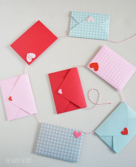 This Mini Envelope Valentine Banner is the perfect addition to your Valentine decor. The mini envelopes are so cute and the puffy heart stickers make the perfect "stamps." Create your own with the tutorial on the blog. Heart Sticker Craft, Diy Valentine Envelopes, Mini Envelopes Ideas, Valentines Day Envelopes Diy, Envelope Garland, Diy Mini Envelopes, Mini Envelopes Diy, Envelope With Heart, Valentine Dance