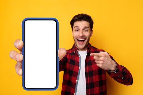 Excited guy pointing at black empty smar... | Premium Photo #Freepik #photo #showing-phone #phone #smartphone #mobile-mockup Guy On Phone, Man Holding Phone, Mobile Png, Youtube Photo, Person Png, Graphic Pictures, Shop Counter Design, Mobile Frame, Thumbnails Youtube Background