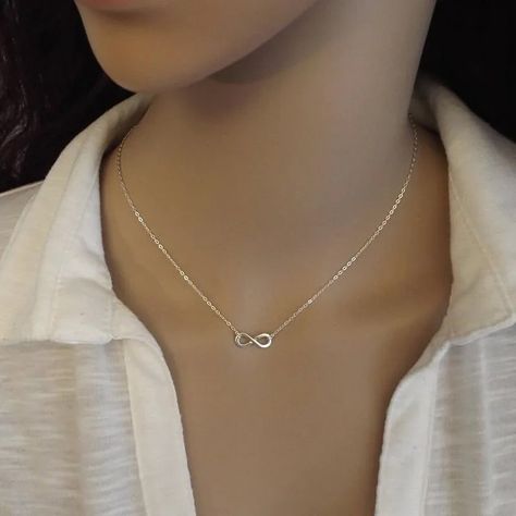 Infinity Abundance Pendant Choker Necklace Elevate your style with the Infinity Abundance Pendant Choker Necklace. Crafted from stainless steel, this elegant piece combines the infinity symbol with the concept of abundance. Ideal for women, it represents endless prosperity and makes a meaningful accessory for any occasion. #InfinityPendant #ChokerNecklace #StainlessSteelJewelry #FemmeNecklace #ElegantAccessory #FashionJewelry #ProsperityCharm #MeaningfulGift #AbundanceSymbol Infinity Symbol Necklace, Infinity Necklace Silver, Engagement Necklaces, Pendant Choker Necklace, Infinity Pendant, Pendant Choker, Infinity Necklace, Infinity Symbol, The Infinity