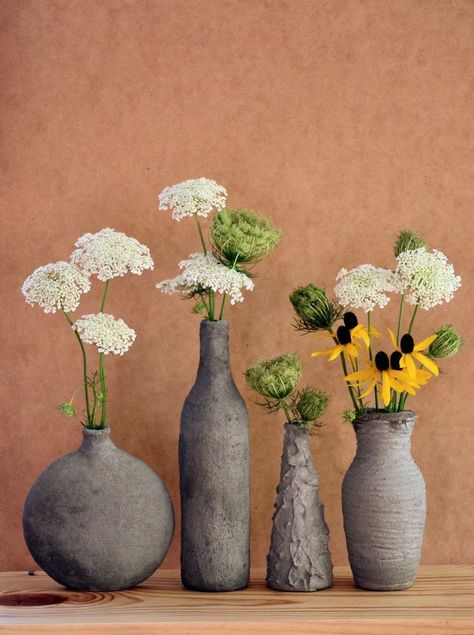 These cement-covered glass vases are both easy and fun to make! [media_id:3477958] First, get yourself an inexpensive glass vase, or get a glass bottle from you… Cement Furniture, Cement Vase, Old Glass Bottles, Easy Diy Decor, Concrete Furniture, Concrete Crafts, Concrete Projects, Cement Crafts, Diy Bottle