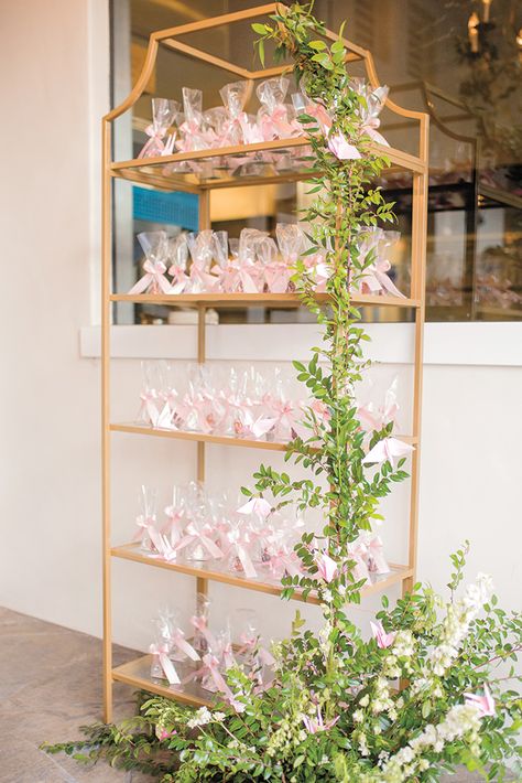 Wedding favor display Courtyard Wedding Reception, Wedding Favor Display, Romantic Courtyard, Mendoza Wedding, Paper Crane Wedding, Favor Display, Gold Shelf, Downtown Santa Barbara, Pretty Invitations