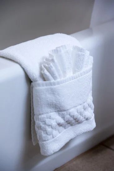 How To Decorate Towels In A Bathroom: 22 Unique Ways Towels In Baskets In Bathroom, How To Hang Bathroom Towels On Towel Bar, Decorative Towels In Bathroom Display Ideas Guest Rooms, Decorative Towel Folding Hanging, Displaying Towels In Bathroom, How To Hang Bath Towels Decoratively, Hanging Bath Towels Display, Hand Towel Bathroom Ideas, Guest Bath Towel Display