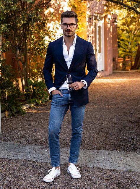 A seamless blend of formal and casual with a sharp navy blazer and white shirt paired with blue jeans and crisp white sneakers, perfect for any occasion that calls for stylish versatility. Jean And Sport Coat Men, Navy Blue Blazer Outfit Mens Casual, Navy Jacket Outfit Men, Jeans And Blazer Outfit Men, Navy Blue Blazer Outfit Mens, Blazer And White Shirt, Blazer White Dress, Navy Blue Blazer Outfit, Navy Blazer Outfits