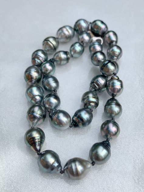 Large, Baroque, Circled, Tahitian Pearl Necklace This necklace is knotted with black thread and finished with a white gold clasp.  It measures 17 inches long. The pearls range from 11-15mm. Very large pearls!  A truly beautiful gift for someone special or for yourself! Tahiti Vacation, Black Pearl Jewelry, Tahitian Pearls Jewelry, Large Pearl Necklace, South Sea Pearls Earrings, Tahitian Pearl Necklace, Pearls Jewelry, Black Pearl Necklace, Purple Sapphire