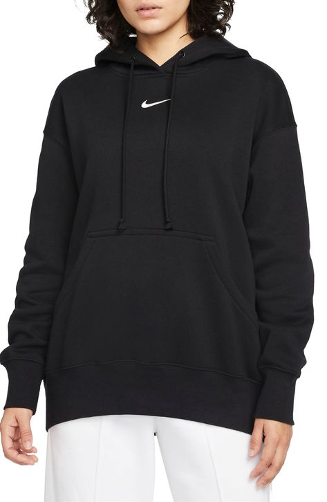 Exaggerated features like an oversized kangaroo pocket and wide ribbing enhance the roomy fit of this sporty hoodie with a cozy brushed fleece interior. 28" length (size Medium) Drawstring hood Kangaroo pocket 80% cotton, 20% polyester Machine wash, tumble dry Imported Hoodie Zumiez, Sporty Hoodie, Sweatpants Women, Nike Sportswear Women, Wide Leg Sweatpants, Nike Sweatshirt, Loungewear Luxury, Nike Fleece, Nike Sweatshirts