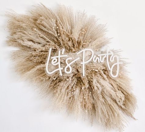 Neon sign "Let's Party" on top of pampas grass swag Pampas Grass Backdrop, Boho Salon Decor, Fall Floral Table, Pampas Arrangement, Arch Arrangement, Grass Backdrops, Boho Backdrop, Boho Wedding Flowers, Pampas Grass Decor