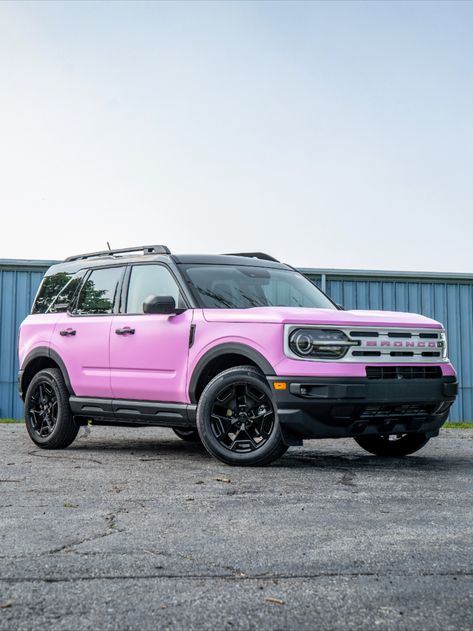 Satin pink 2023 Ford Bronco Sport with a white grille and black powder coat wheels. Pink Bronco Sport, Hot Pink Bronco, White Bronco Sport, Ford Bronco Wallpaper Iphone, Pink Car Paint, Pink Ford Bronco, Pink Chevy Trucks, Pink Bronco, 2023 Ford Bronco Sport