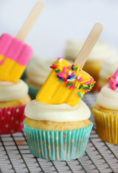 Bright and colorful summer themed cupcakes with a tangy twist! These lemonade cupcakes with DIY popsicle lollipop toppers are what summers are made of! Summer Themed Cupcakes, Summer Cupcake, Beach Theme Cupcakes, Cake Mix Cupcakes, Popsicle Party, Lemonade Cupcakes, Summer Cupcakes, Two Cool, Diy Popsicle