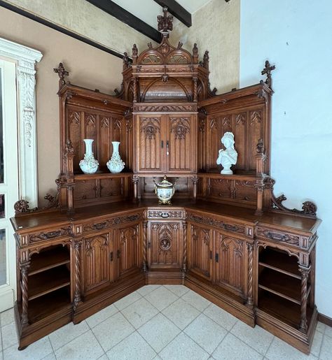 Special note for this item:  This cabinet is currently in our Belgian warehouse and scheduled to arrive here in March 2024.  Description of item for sale: This magnificent antique Gothic revival corner cabinet is from France and it dates to the late 1800's or possibly early 1900's.  At nearly 12 feet tall at its peak, it's truly a signature piece.  It likely was first made for a monastery or other large religious space.  It is made from solid oak and finished to a warm medium/dark oak color.  This cabinet is in very good antique condition with only minor nicks and scratches and a very few missing small trim pieces.  When this cabinet arrives here at our Oregon facility we will inspect, clean and wax as needed prior to shipping to you.  Dimensions: 142" tall and 84" long along each wall (co Victorian Aesthetic Furniture, 1800s Furniture, Gothic House Decor, Antique Display Cabinet, Wood Corner Cabinet, Antique Corner Cabinet, Antique Kitchen Cabinets, French Gothic, Wood Working Projects