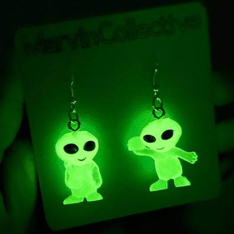 "These glow in the dark alien earrings are the coolest pieces to add to your jewelry collection. They were inspired by the nostalgic aliens that I used to buy from the quarter machines at my local stores. They are fascinating to look at and each alien in the pair has their own unique personality. The ones you receive will absolutely be a surprise along with their small certificate of adoption. 👽 Perfect to gift to yourself or to a friend!  They have a drop length of 2\" inches and the alien itself is 1\" inch in height.  Sold as a pair." Fimo, Gleep Glorp, Certificate Of Adoption, Alien Earrings, Alien Alien, Alien Gift, Insect Jewelry, Life Form, Gold Jewelry Fashion