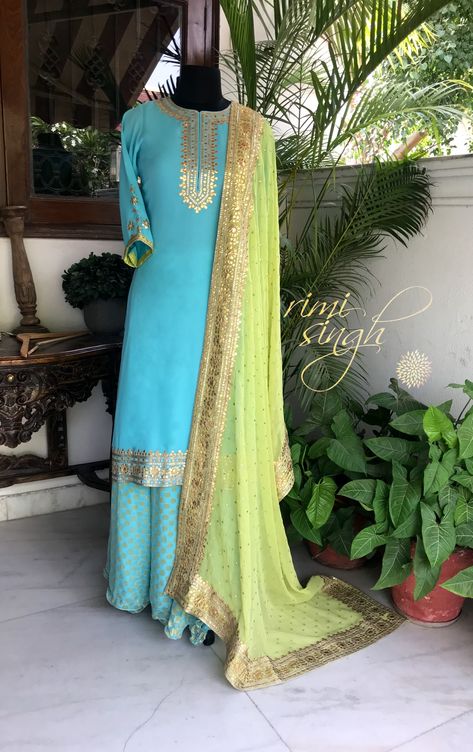 Life is not measured by the number of breaths we take, but by the moments that take our breath away...   Sky blue georgette sharara teamed with a parrot green georgette dupatta with gota hand embroidery. There is gota hand embroidery on the neckline, sleeve and the kurta edge.  Available exclusively at  A 999 Sushant Lok 1  Gurgaon  #9818310054 Sky Blue Outfits For Women, Georgette Sharara, Parrot Green, Indian Designer Suits, Georgette Dupatta, Salwar Kamiz, Embroidery Suits Design, Designer Party Wear Dresses, Boutique Dress Designs