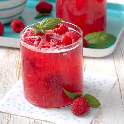 Give iced tea a grown-up twist. Fragrant basil lends flavor and the raspberries give it a bright red color. Tou’ll love the fun fizz and make-ahead convenience! —Laurie Bock Lynden, Washington Raspberry Tea Recipe, Witch Cafe, Homemade Punch, Lynden Washington, Cozy Witch, Fresh Basil Recipes, Batch Cocktail Recipe, Lemon Basil Chicken, Easter Cocktails