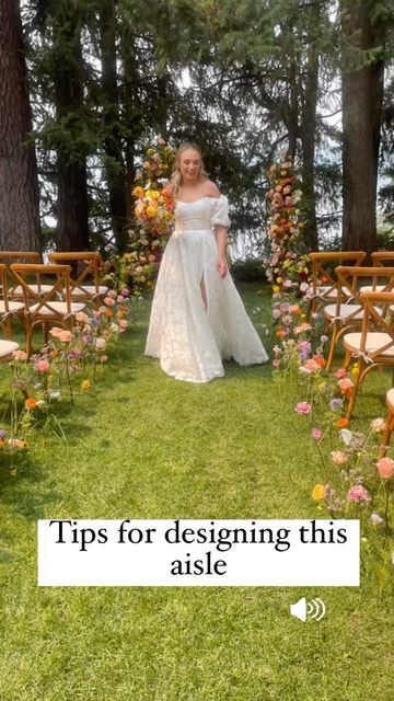 Eden Frei | Coeur D’alene Wedding Florist on Instagram: "Tips for designing this aisle you all adore: 1. The water picks pound into the grass better if it has soft soil. Use a rubber hammer. The picks also came out of the grass with less damage this way. 2. If water picks don’t insert easily, take a battery powered drill to help make the holes 3. This design used approximately 10 full stems per chair which we extended into the path as well. 3. Cut some flowers short and insert at varying heig Flowers Stuck In Ground Wedding, Wildflower Aisle Arrangements, Aisle Floral Decor, Wild Flower Wedding Theme Ceremony Decor, Wild Flower Aisle Wedding, Flowers In Ground Wedding Aisle, Flowers Lining The Aisle, Flowers Lining Aisle, Diy Aisle Flowers