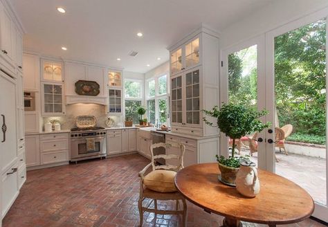 From your foyer to your kitchen, high-traffic interior spaces could benefit from price-wise, easy-care surfaces like brick floors. Here's why. Brick Kitchen Floor, French Door Decor, Brick Floor Kitchen, Brick Floors, Brick Floor, Cottage Style Kitchen, Modern Flooring, Brick Kitchen, American Kitchen