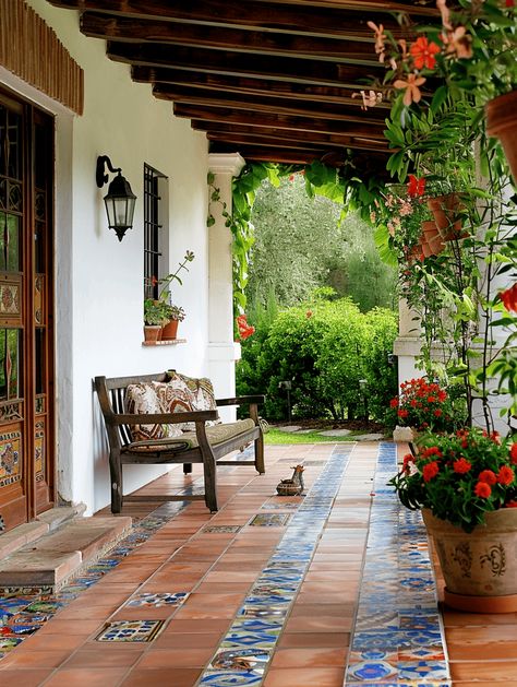 Porch Tile Ideas: Hand-made Spanish Tiles on Terracotta Flooring Saltillo Tile Front Porch, Spanish Colonial Front Porch, Spanish Tiles Outdoor, Colorful Spanish House, Tile Porch Ideas, Garden Tiles Outdoor Ideas, Courtyard Flooring Ideas, Spanish Front Porch, Outside Tiles Front Porches