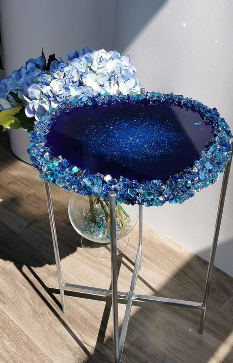 Blue Azure high end table. Luxury series of our high end tables. Made from pure epoxy, multiple layers, decorated with stones inside for glass like effect, reflective additives inside, see through. Decorated with many different coloures of reflective stones: blue, aguamarine, lazur. Dimension: about 38-40 cm Comes with silver /gold legs Small Resin Table, Blue Resin Art, High End Table, Textile Designing, Fashion Advertisement, Resin Tables, Agate Art, Ankle Bracelets Diy, Baby Blue Aesthetic