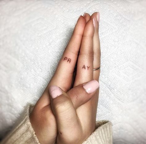 Pray on fingers hand tattoo #tatto #pray #fingertattoo #hands Praying Hand Tattoo For Women, Tiny Praying Hands Tattoo, Bible Verse Finger Tattoo, Biblical Finger Tattoos, This Too Shall Pass Finger Tattoo, In The End We All Pray Tattoo, Pray Finger Tattoo, Pray Tattoo On Fingers, Christian Finger Tattoos For Women