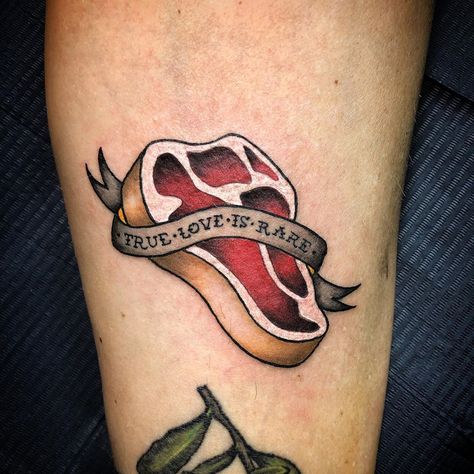 Steak tattoo for every carnivore out there!True love is rare. Old school steak tattoo. 𝓜𝓸𝓷𝓲𝓴𝓪 on Instagram: ““True love is rare” 🥩 #steak #steaktattoo #tattoo #tattoos #meattattoo #loveofmeat #carnivore #carnivoretattoo #tattooformen…” Love Me Tender Tattoo, Butcher Tattoo Ideas, Steak Tattoo, Love Kills Tattoo, Traditional Food Tattoo, Funny Food Tattoos, Food Tattoo Ideas, Cocktail Tattoo, Food Tattoo