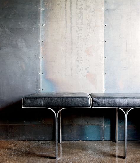 An aluminum bench harmonizes with the industrial nature of the galvanized-steel walls and the polished concrete floor within a metal broker's Collingwood, Ontario, house. Photo by Lorne Bridgman. Metal Facade, Design Industrial, Polished Concrete, Furniture Details, Steel Wall, Interior Furniture, Concrete Floors, 인테리어 디자인, Interior Spaces