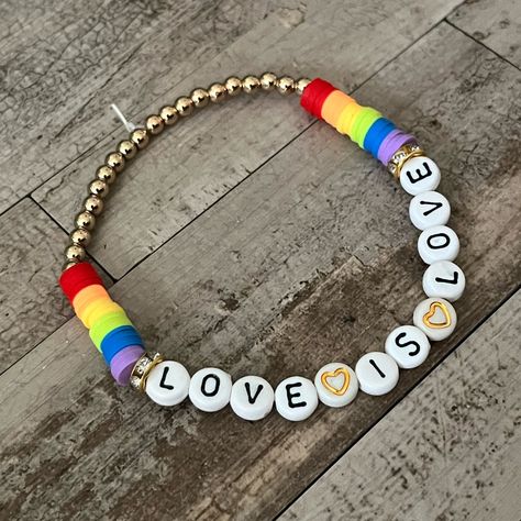 New! Heishi Bead Hand Crafted One-Of-A-Kind Bracelet “Love Is Love” Letter Beads Gold Tone Rhinestone And Ball Spacers Elastic One Size Fits Most Trending Bohemian Pride Lgbtq Heishi Bead Bracelets Are Recommended To Be Rolled Down From The Top Of The Hand To The Wrist All Black Heart Shop Jewelry Is Handmade And Comes In A Jewelry Bag Pride Bracelet Diy Beads, Pride Bracelet Ideas, Pride Beaded Bracelets, Pride Jewelry Diy, Pride Friendship Bracelet, Lgbtq Bracelet, Pride Bracelets, Heishi Bead Bracelet, Betsey Johnson Bracelet