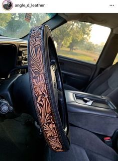 Handmade leather steering wheel cover Western Leather Steering Wheel Cover, Western Steering Wheel Cover, Western Seat Covers, Truck Interior Ideas, Western Car Accessories, Leather Car Accessories, Truck Interior Accessories, Western Car, Leather Steering Wheel Cover