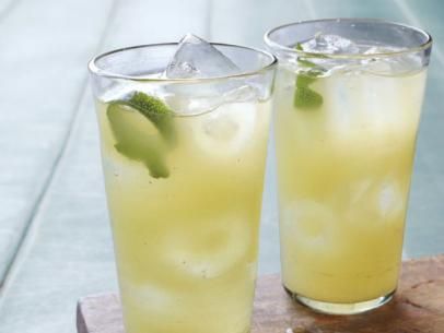 Tequila Bumblebee Recipe | Geoffrey Zakarian | Food Network Peach Punch, Italian Drinks, Sparkling Lemonade, Lemonade Recipes, Think Food, Smoothie Drinks, Sparkling Water, How To Squeeze Lemons, Non Alcoholic Drinks