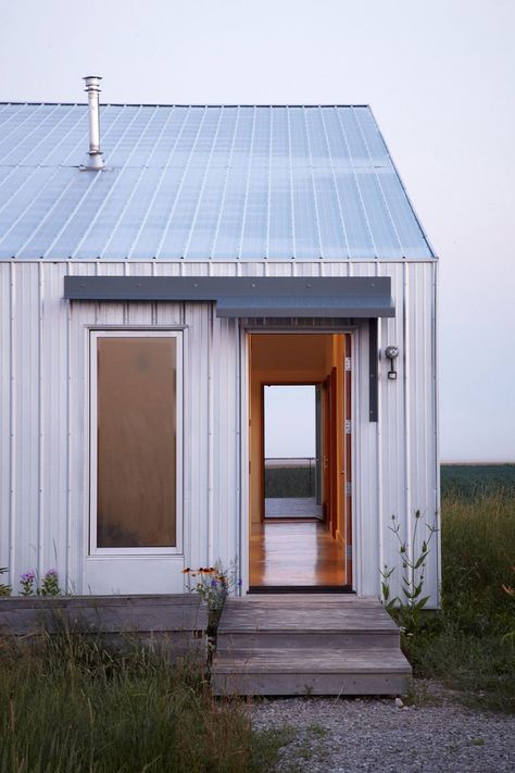 Exterior, Metal Siding Material, and Gable RoofLine “There’s a presence to that place—it’s vast, and constantly shifting,” Moffitt says. “It was clear that this house should be an observation shed for the changing landscape beyond.” Photo 11 of 11 in An Off-Grid Home That Relies on the Sun and the Wind Modern Shed, Steel Roofing, Rural House, Metal Siding, Shed Homes, Shed Design, Metal Buildings, Prefab Homes, Metal Roof