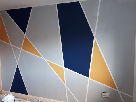 Geometric wall navy gray yellow Wall Painting Ideas Geometric, Geometric Wall Painting, Accent Wall Bedroom Paint, Geometric Accent Wall, Wall Painting Designs, Khaki Walls, Geometric Wall Paint, Flat Decor, Family Photo Wall