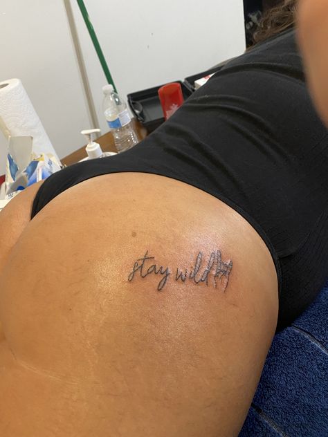 Keep It Wild Tattoo, Thigh Front Tattoos Women, Underneath Buttcheek Tattoo, Stay Wild Buttcheek Tattoo, Stay Wild Tattoo Ideas, Stay Wild Tattoos For Women, Small Tattoos On Buttocks For Women, Under Buttocks Tattoo Women, Buttocks Tattoos Women