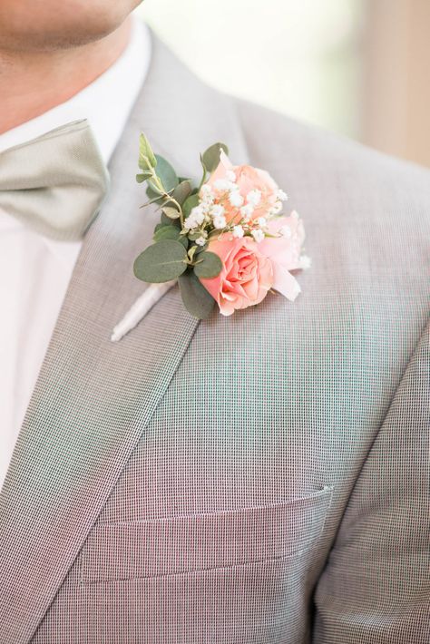 Pink Roses and Baby's Breath Boutonniere | Audrey Rose Photography https://www.theknot.com/marketplace/audrey-rose-photography-norfolk-va-766665 | Morrison's Flowers & Gifts https://www.theknot.com/marketplace/morrisons-flowers-and-gifts-williamsburg-va-512136 Peach And White Boutonniere, Peach Boutonniere Wedding, Suit With Peach Tie, Groom Suit Pink Tie, Peach Buttonhole, Peach Groomsmen, Peach Boutonniere, Apricot Wedding, Wearable Flowers