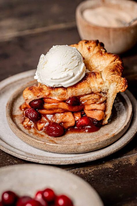 If you're someone who likes to go out ALL OUT on Thanksgiving, then this apple cranberry pie is for you! This isn't an ordinary apple pie. It's packed full of warm & cozy spices, juicy apples, tart cranberries, and even a touch of orange zest to round it all out. Cran Apple Pie, Apple And Cranberry Pie, Apple Pie Photography Food Styling, Apple Strawberry Pie, Cranberry Apple Pie Recipe, Apple Cranberry Tart, Apple Pie Spice Cake, Apple Pie Thanksgiving, Cranberry Pie Thanksgiving