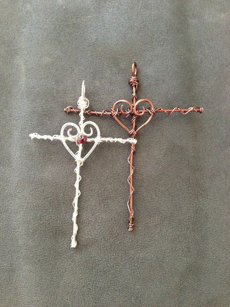 Wire Wrapped Heart/Cross pendants: one is all copper wire and the other is silver plated wire with a small garnet bead. Wire Wrapped Heart, Wire Jewelery, Wire Wrap Jewelry Designs, Cross Crafts, Wire Jewelry Designs, Beaded Cross, Diy Wire Jewelry, Wire Work Jewelry, Handmade Wire Jewelry