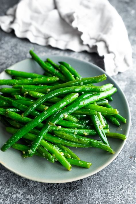 Sautéed green beans with garlic butter is an easy ten minute side dish! Serve it for a weeknight dinner or a special occasion. #sweetpeasandsaffron Sauteed Green Bean Recipes, Green Beans With Garlic, Sauteed Greens, Sauteed Green Beans, Garlic Green Beans, Frozen Green Beans, Fresh Green Beans, Green Bean Recipes, Bean Casserole