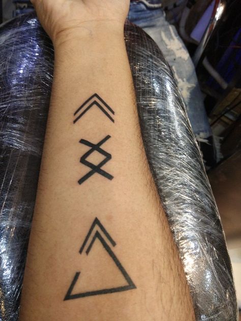 170+ Rune Tattoos Ideas (2022) Vikings Ink - TattoosBoyGirl Viking Rune Tattoo, Tatuagem Masculina Pequena, Glyph Tattoo, Rune Tattoo, Omerta Tattoo, Symbol Tattoo, Cool Small Tattoos, Symbol Tattoos, Small Tattoos For Guys