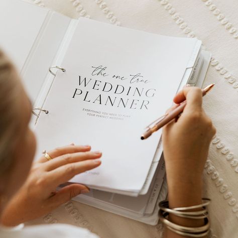 Planning your dream wedding should be a joy, not a scramble. That's why our  stylish A4, two-ring binder file is here to help. Crafted with love by our Perth team, this isn't mass-produced; it's made with the personal touch you deserve.  Featuring 25 tabbed compartments, your wedding plans will be perfectly organized. Select a design you adore for the personalized cover and spine, printed on premium paper and nestled within a sturdy plastic insert. Expect your cherished file within a week (plus shipping time), with standard or express options available at checkout. 
.#WeddingPlanning #BrideToBe #WeddingInspiration #EventPlanning #DreamWedding Diy Wedding Planner Binder, Wedding Planner Aesthetic, Wedding Binder Organization, Plaas Troue, Wedding Organisation, Rebecca Serle, 2 Ring Binder, Wedding Planner Notebook, Wedding Planning Binder