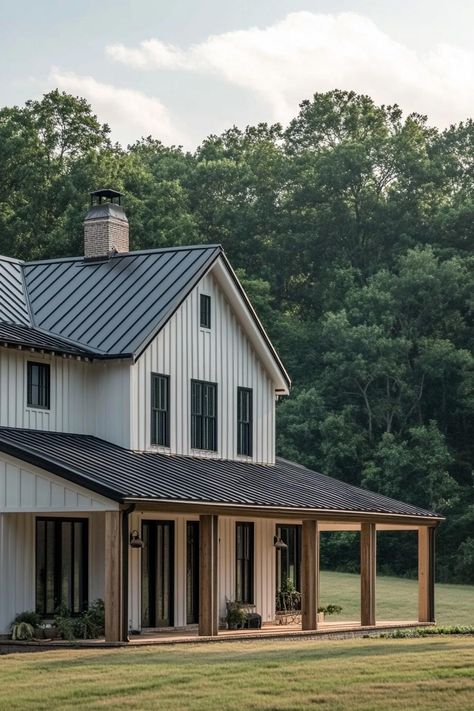 Charming white house with a black metal roof and wooden porch. Homes with sprawling acreage offer more space for both your wildest dreams and that ever-growing collection of garden gnomes. Houses With Land, Homes With Land, Barn Dominium, Black Metal Roof, House With Land, Farmhouse Architecture, Wooden Porch, Suburban House, Dormer Windows