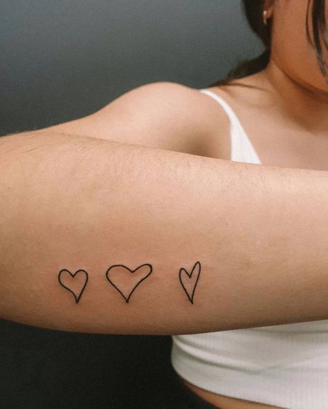 Love Heart Tattoo On Arm, Trio Heart Tattoo, Hearts On Arm Tattoo, Heart Tattoo Handwriting, Heart Tattoo On Side Of Wrist, Heart Tattoo On Forearm, Hand Drawn Heart Tattoo Placement, Handwritten Heart Tattoo, Hearts In A Row Tattoo