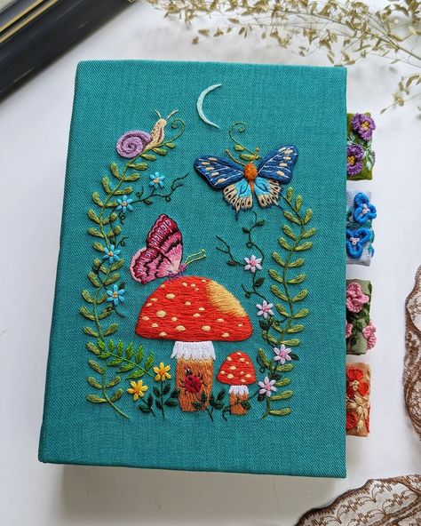 It's always a challenge to fit my embroidery into the book cover, but I'm happy with how it turns out. 🪡🍄 #handembroidery #artjournal… | Instagram Embroidery Book Cover Ideas, Hand Embroidered Book Cover, Embroidery On Book Cover, Embroidery Book Cover, Journal Covers Diy, Vintage Core, Book Embroidery, Embroidered Book, Themed Journal