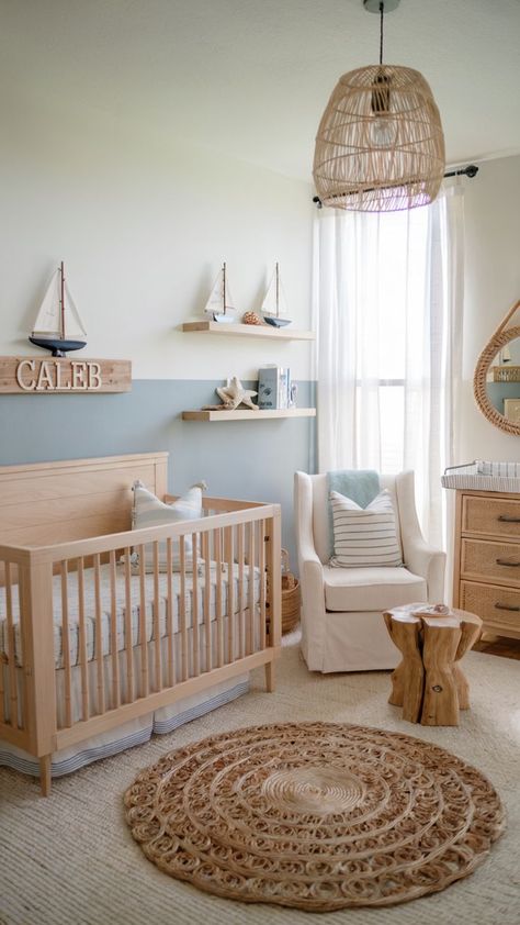 A nautical-themed nursery with light wood furniture, sailboat decor, and calming blue and white accents. Sailing Theme Nursery, Baby Boy Room Aesthetic, Norwegian Nursery, East Coast Nursery, Water Nursery Theme, Beachy Nursery Boy, Coastal Cottage Nursery, Beach Themed Nursery Boy, Vintage Sailboat Nursery