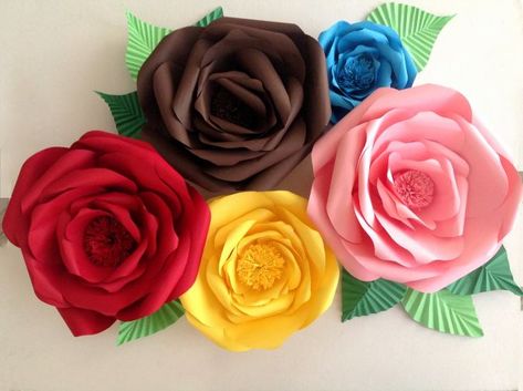 Looking for a fun paper craft idea? Learn how to make paper roses with this easy DIY paper rose tutorial. Follow these step-by-step instructions to create beautiful paper roses that will brighten up any space. Finish by adding a stem and leaves. With this free tutorial, you'll be able to create stunning paper roses in no time! Use them for your home decor or as party decorations on a budget. How To Make Paper Flowers Bouquet Rose Tutorial, Small Paper Roses Diy Easy, Paper Rose Buds How To Make, Cricut Roses Paper Flowers, Small Flower Making Paper, Giant Paper Flowers Diy, Paper Flowers Diy Easy, Large Paper Flowers, Diy Crafts Paper Flowers