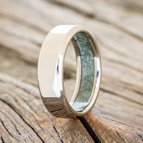 Product Details Ring Style: A custom, handcrafted men's wedding ring featuring a unique crushed moss agate lining. Additional inlay options are available upon request. Width: The width of the ring pictured is 6mm, but can be ordered in a custom width accompanied by a design change fee. Please state your desired width in the Custom Requests section during checkout, and we will reach out to you for payment. Customizable: Because each ring is handcrafted to order, we can customize yours using uniqu Men’s Wedding Rings, Boho Wedding Bands, Green Engagement Rings, Agate Wedding Ring, Agate Wedding, Simple Rings, Staghead Designs, Men's Wedding Ring, Ring Ideas