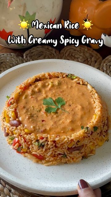 TraveliciousBites on Instagram: "Delicious Mexican Rice with Creamy and Savory Sauce 😍✨

Ingredients:
- 2 tsp of butter
- Chopped veggies (red bell pepper, yellow bell pepper, broccoli, sweetcorn)
- 1/4th cup overnight soaked rajma 
- 2 tsp of oregano
- 2 tsp of salt
- 1 teaspoon of pizza sauce
- 1/2 teaspoon of chili powder
- Boiled rice
- 2 tsp of chili flakes
- Tomato purée
- Schezwan chutney
- Amul cream
- Slice of cheese

Instructions:
1. In a pan, add 1 teaspoon of butter.
2. Add red and yellow bell peppers, broccoli, sweetcorn, and soaked plus boiled rajma.
3. Cook for 5-8 minutes until veggies are crunchy.
4. Add oregano, salt, chilli flakes, and chili powder. Mix well.
5. Add boiled rice , coriander , lemon juice and cook for another 2 minutes. Mexican rice is ready.
6. In anothe Spicy Mexican Rice, Schezwan Chutney, Lunch Recipes Indian, Slice Of Cheese, Spicy Gravy, Chopped Veggies, Boiled Rice, Yellow Bell Pepper, Indian Rice Recipes