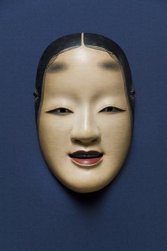 This modern Noh mask from Japan portrays the face of a beautiful young woman. Theatrical Masks, Japanese Noh Mask, How To Draw Eyelashes, History Meaning, Brown Hairstyles, Ancient Gods, Noh Mask, Mask Painting, Japanese Mask