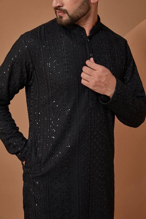 Black georgette kurta with all over chikankari work in sequin embellishments. Components: 1 Pattern: Embroidery Type Of Work: Chikankari Neckline: Stand Collar Sleeve Type: Full Sleeves Fabric: Georgette  Color: Black Other Details:  Note: Pant worn by the model is not for sale Occasion: Sangeet - Aza Fashions Black Designer Kurta For Men, Black Kurthi Models Latest, Black Kurta Men, Kurta Pajama Men Wedding, Kurta Pajama Punjabi, Black Kurti, Georgette Kurta, Boys Kurta Design, Kurta Pajama Men